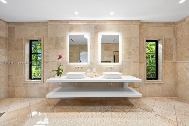 a bedroom with a large bed and a couch