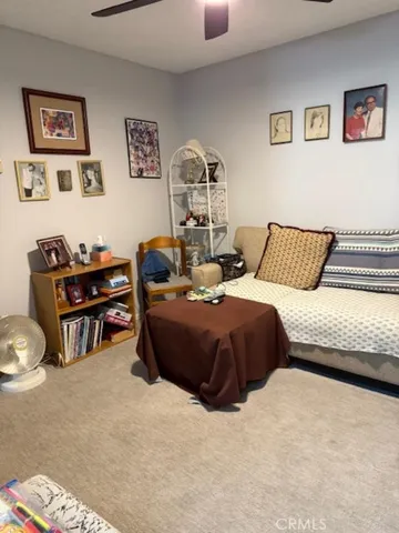 a bedroom with a bed and lamp