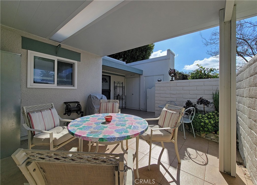 2082 Ronda Granada, Unit D Laguna Woods, CA 92637 - Photo 15 of 36 a outdoor dining space with furniture and outdoor view