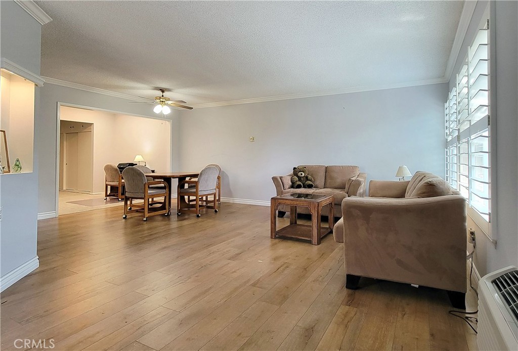 2082 Ronda Granada, Unit D Laguna Woods, CA 92637 - Photo 16 of 36 a living room with furniture and wooden floor