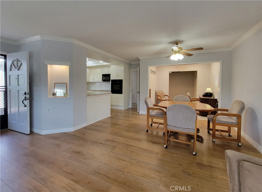 2082 Ronda Granada, Unit D Laguna Woods, CA 92637 - Photo 18 of 36 a view of a livingroom with furniture and a kitchen