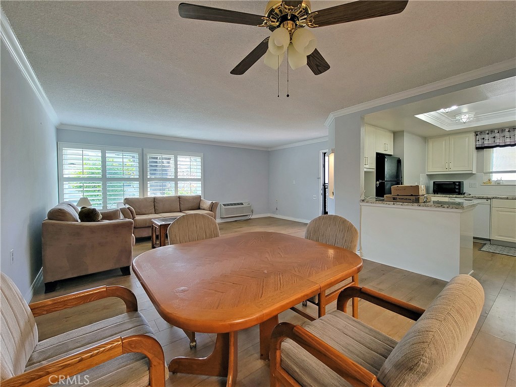2082 Ronda Granada, Unit D Laguna Woods, CA 92637 - Photo 19 of 36 a living room with furniture a flat screen tv and a window