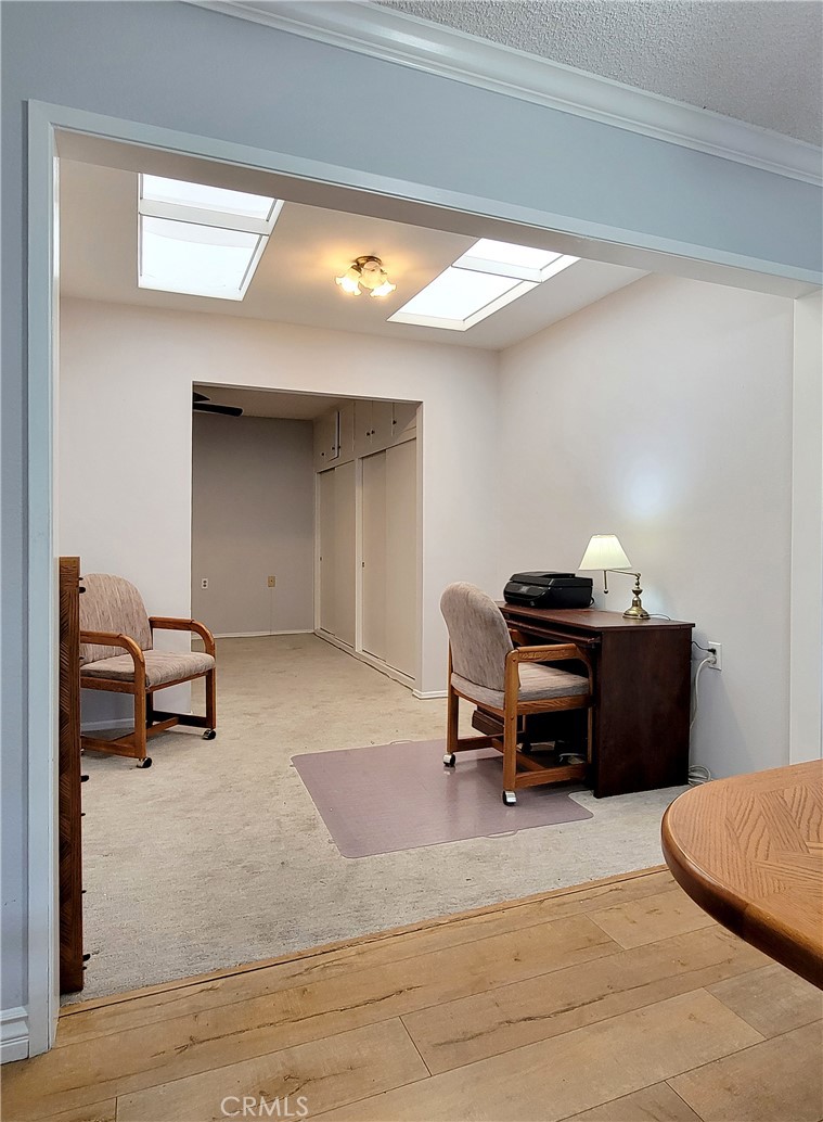 2082 Ronda Granada, Unit D Laguna Woods, CA 92637 - Photo 24 of 36 a living room with a couch and a piano