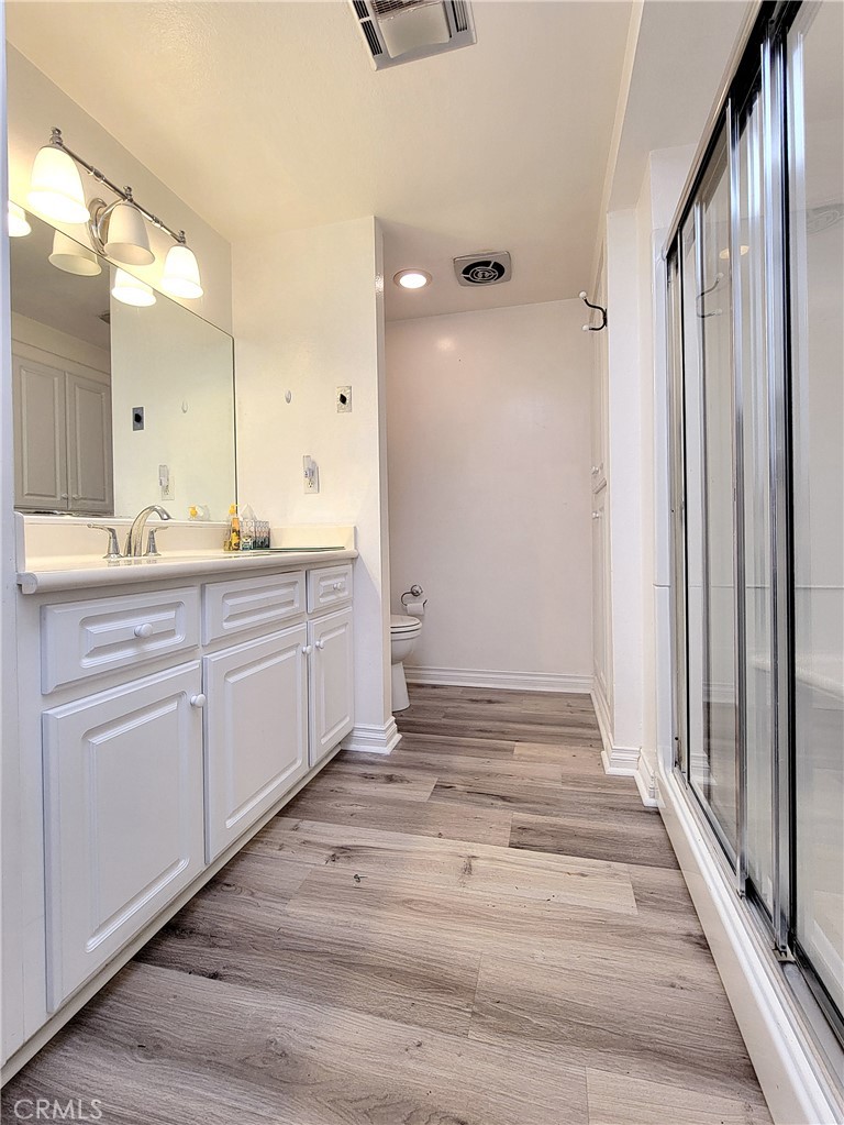 2082 Ronda Granada, Unit D Laguna Woods, CA 92637 - Photo 29 of 36 a bathroom with a sink and mirror