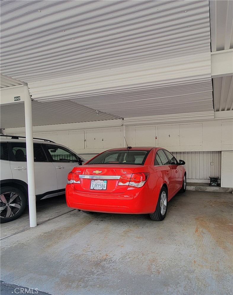 2082 Ronda Granada, Unit D Laguna Woods, CA 92637 - Photo 35 of 36 a front view of a house with a garage