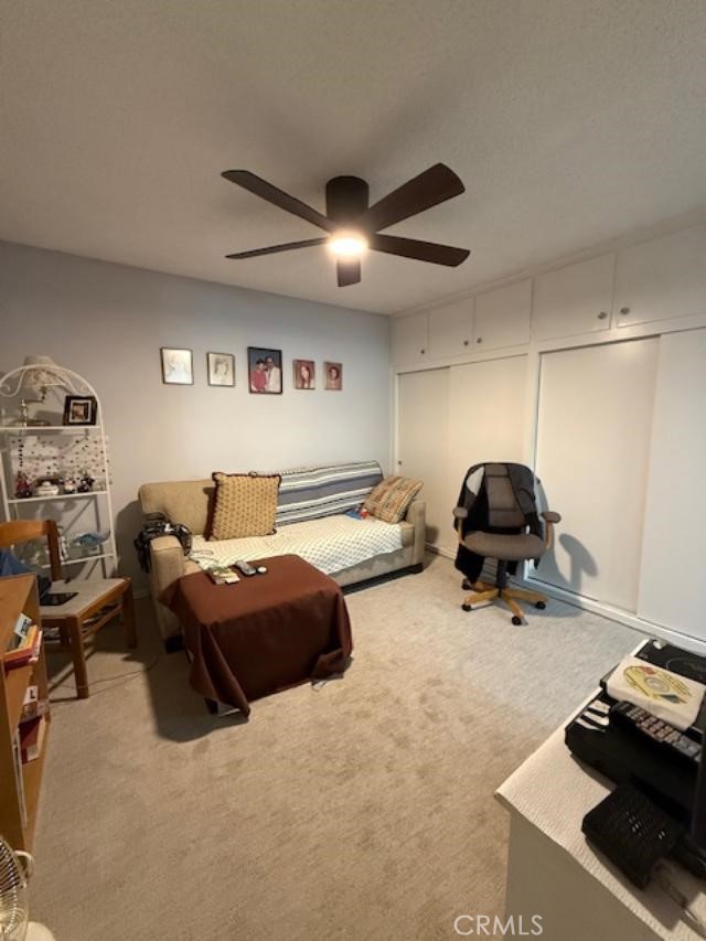 2082 Ronda Granada, Unit D Laguna Woods, CA 92637 - Photo 7 of 36 a living room with furniture a couch and a chandelier