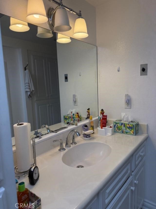 2082 Ronda Granada, Unit D Laguna Woods, CA 92637 - Photo 8 of 36 a bathroom with a sink and a mirror