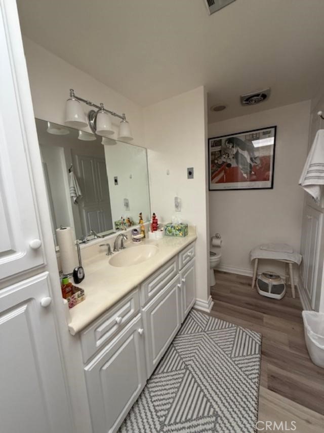 2082 Ronda Granada, Unit D Laguna Woods, CA 92637 - Photo 9 of 36 a bathroom with a sink and a mirror