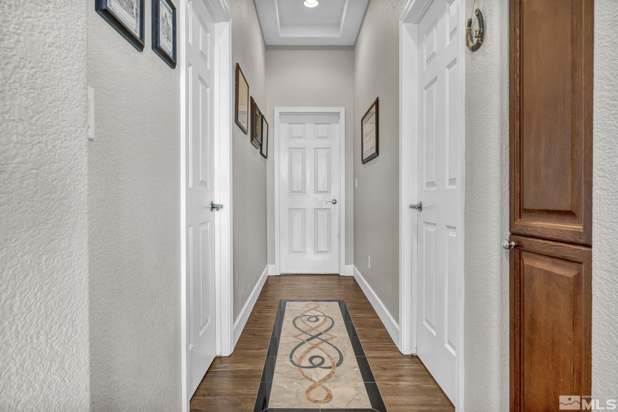 6824 Marble Canyon Road Reno, NV 89511 - Photo 15 of 30 a view of a hallway with wooden floor and staircase