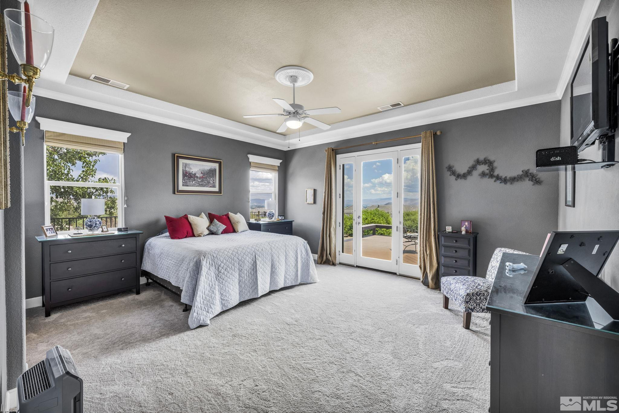 6824 Marble Canyon Road Reno, NV 89511 - Photo 19 of 30 a spacious bedroom with a bed and a couch