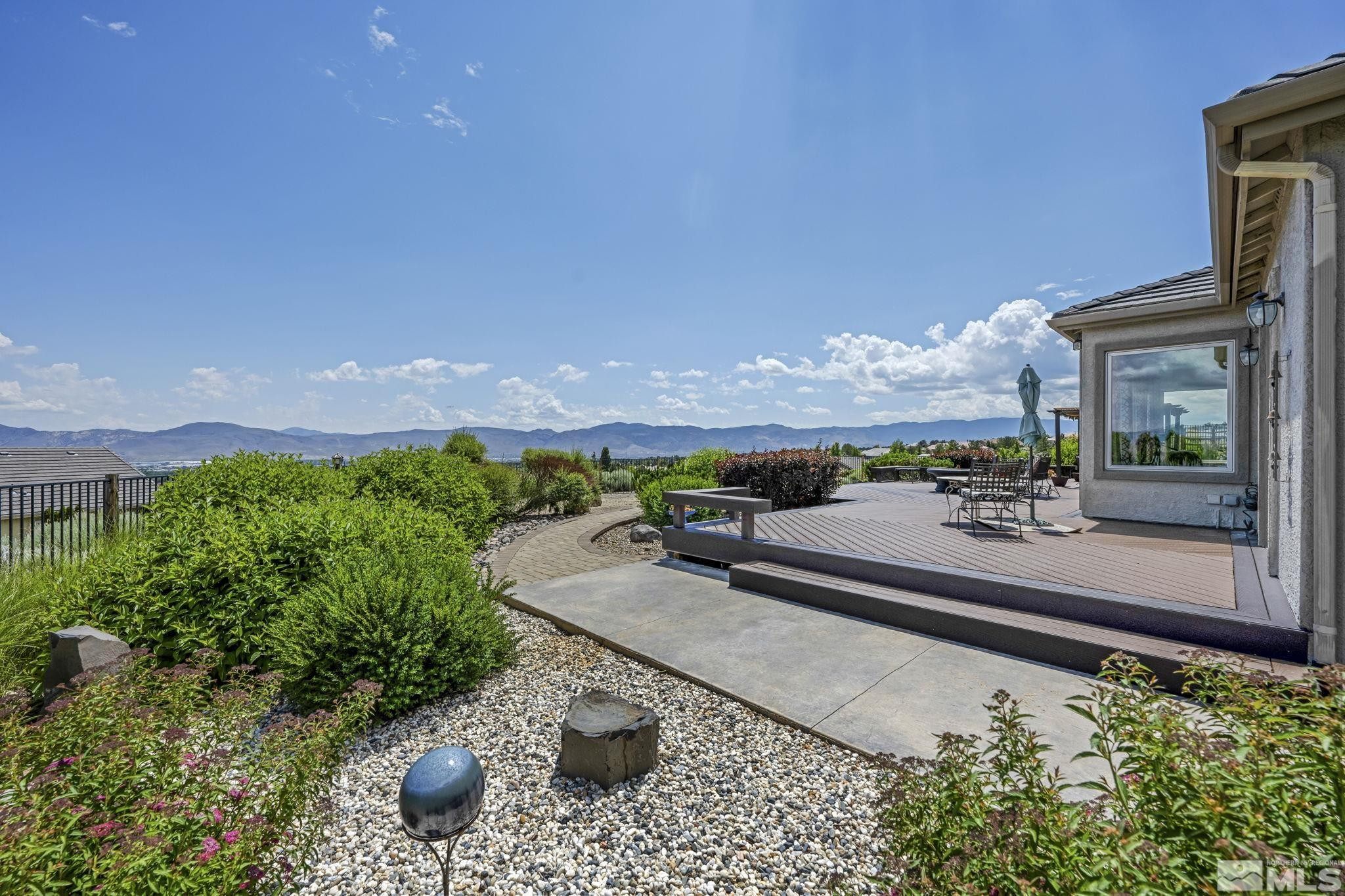 6824 Marble Canyon Road Reno, NV 89511 - Photo 21 of 30 a view of a terrace with a garden and mountain view