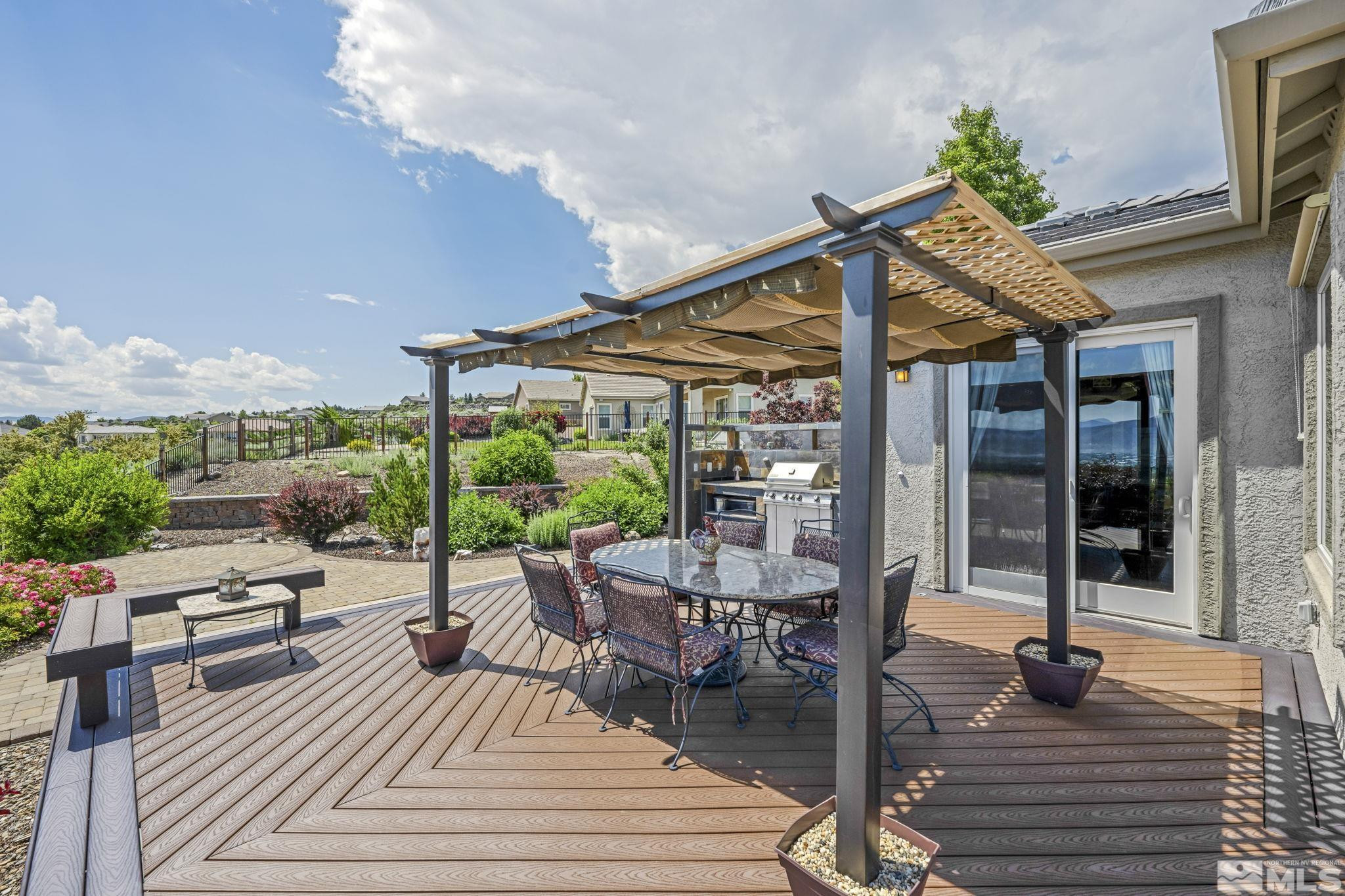 6824 Marble Canyon Road Reno, NV 89511 - Photo 23 of 30 a patio with glass top table and chairs