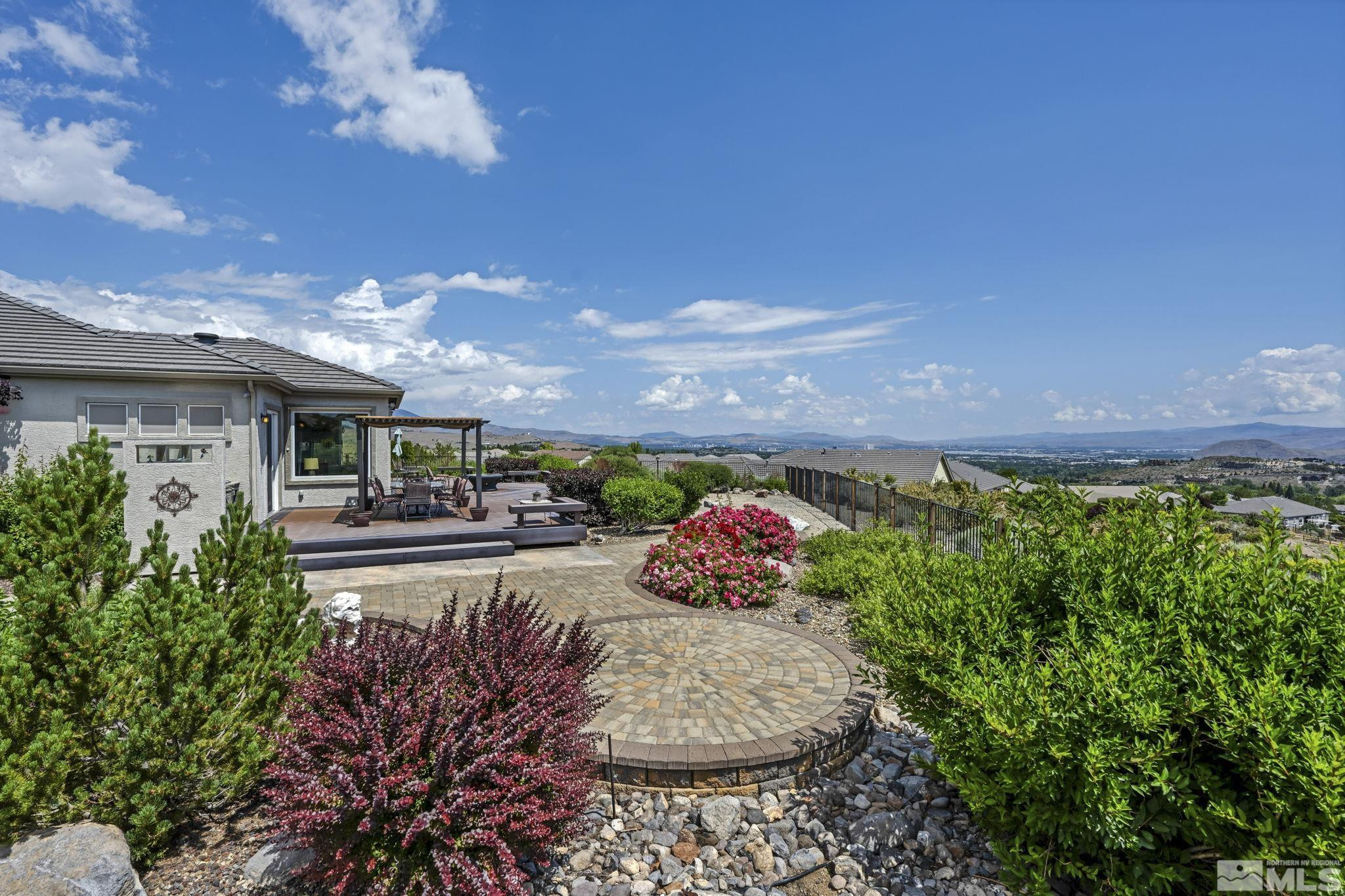 6824 Marble Canyon Road Reno, NV 89511 - Photo 25 of 30 a front view of a house with a yard and outdoor seating