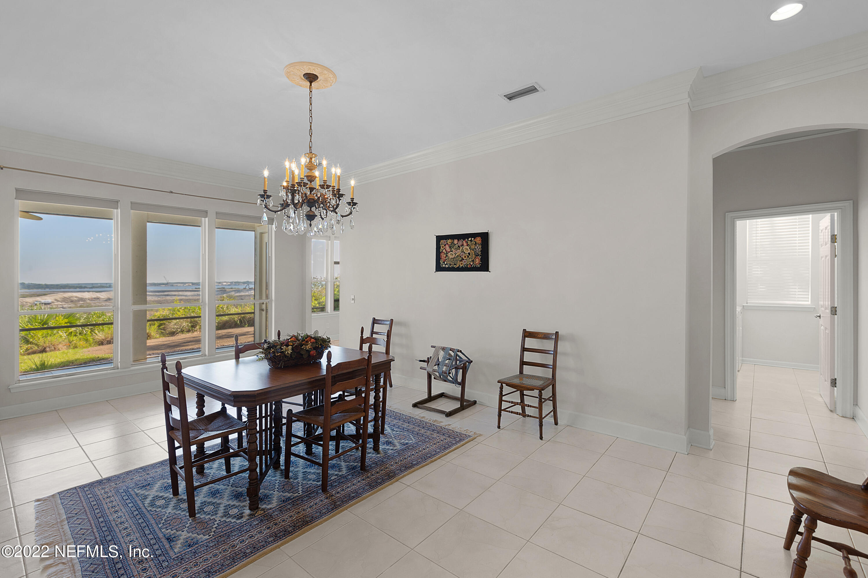13263 Fort Caroline Road Jacksonville, FL 32225 - Photo 14 of 64 a view of a dining room with furniture and chandelier