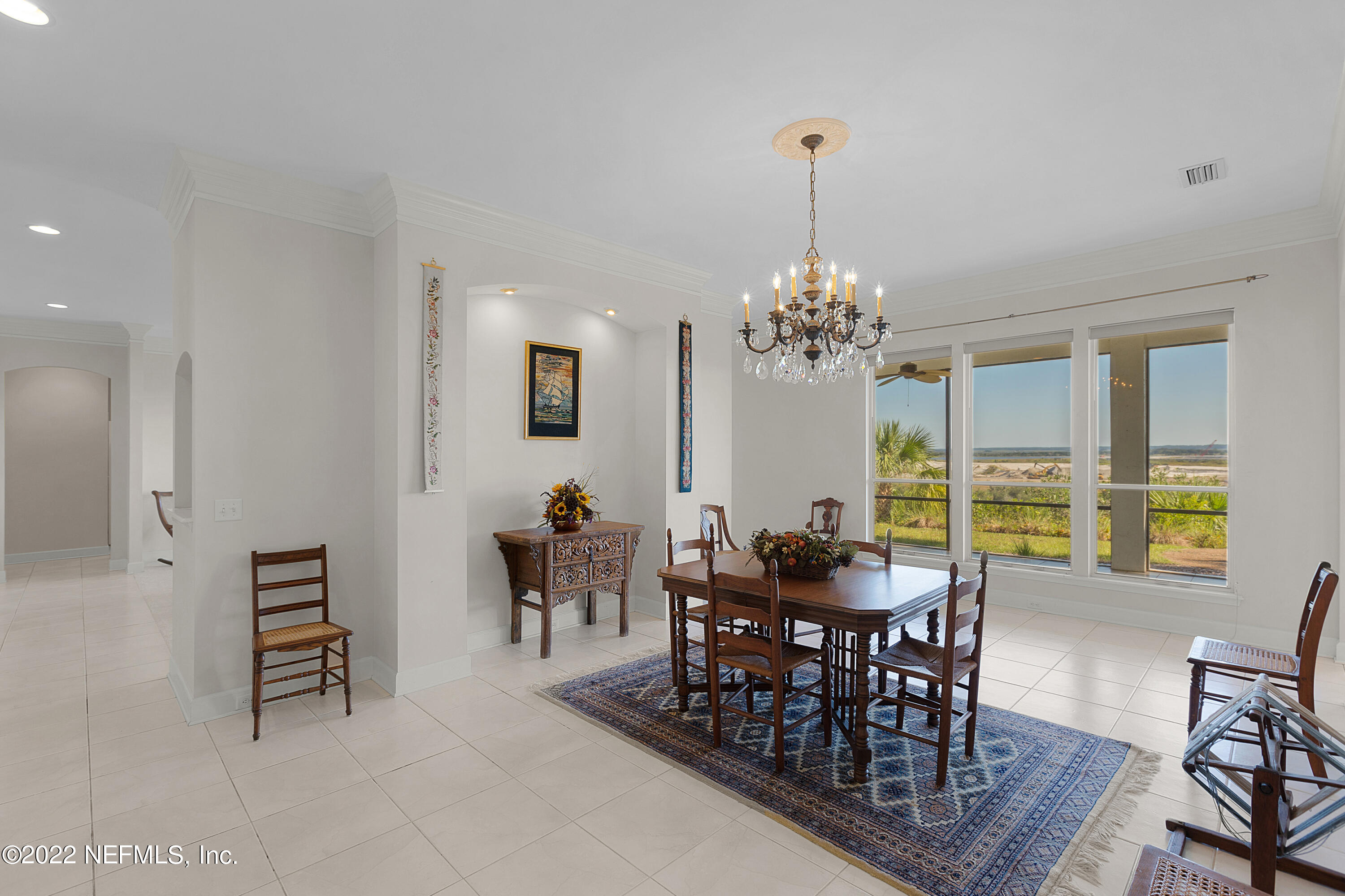 13263 Fort Caroline Road Jacksonville, FL 32225 - Photo 15 of 64 a view of a dining room with furniture and chandelier