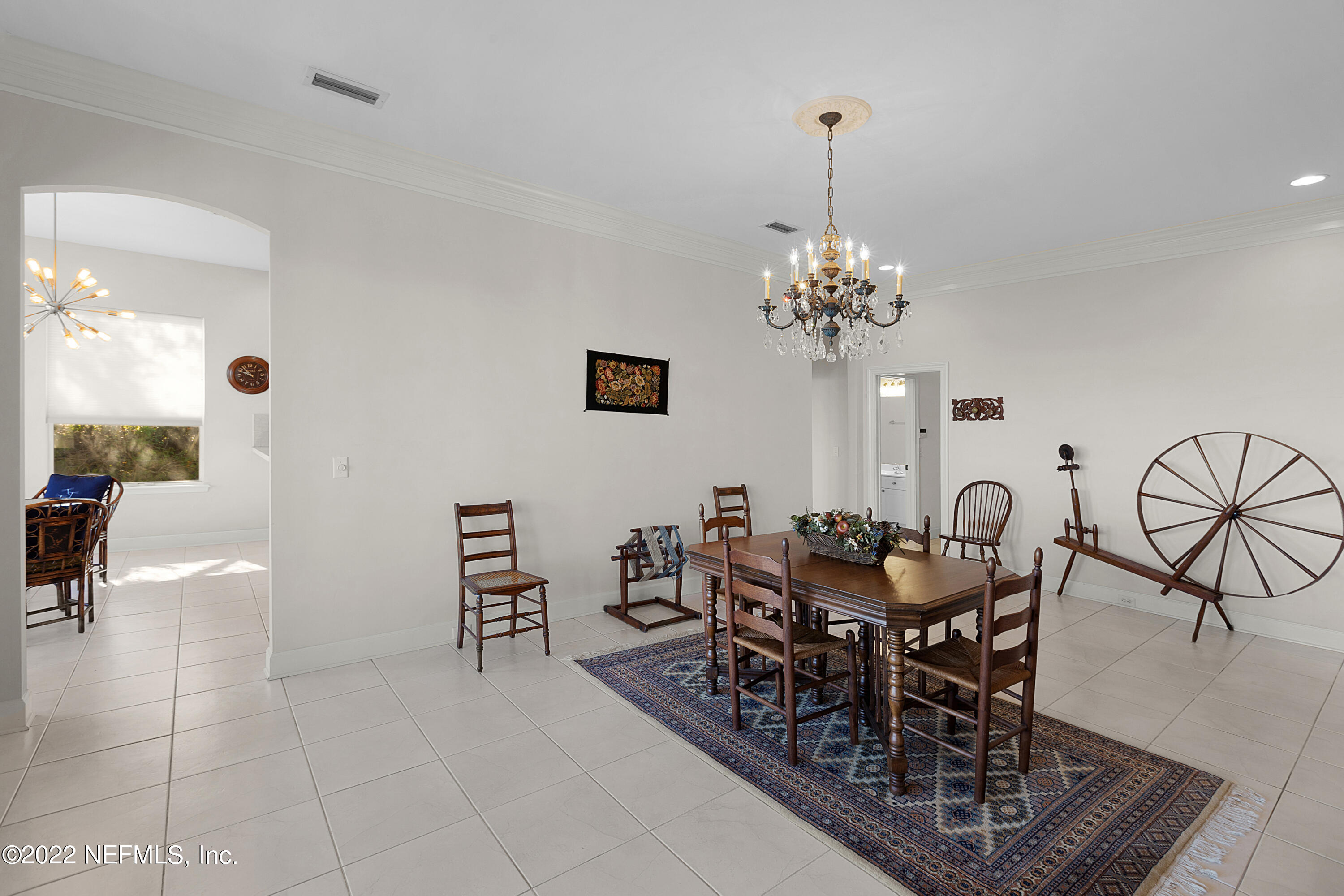 13263 Fort Caroline Road Jacksonville, FL 32225 - Photo 16 of 64 a view of a dining room with furniture and chandelier