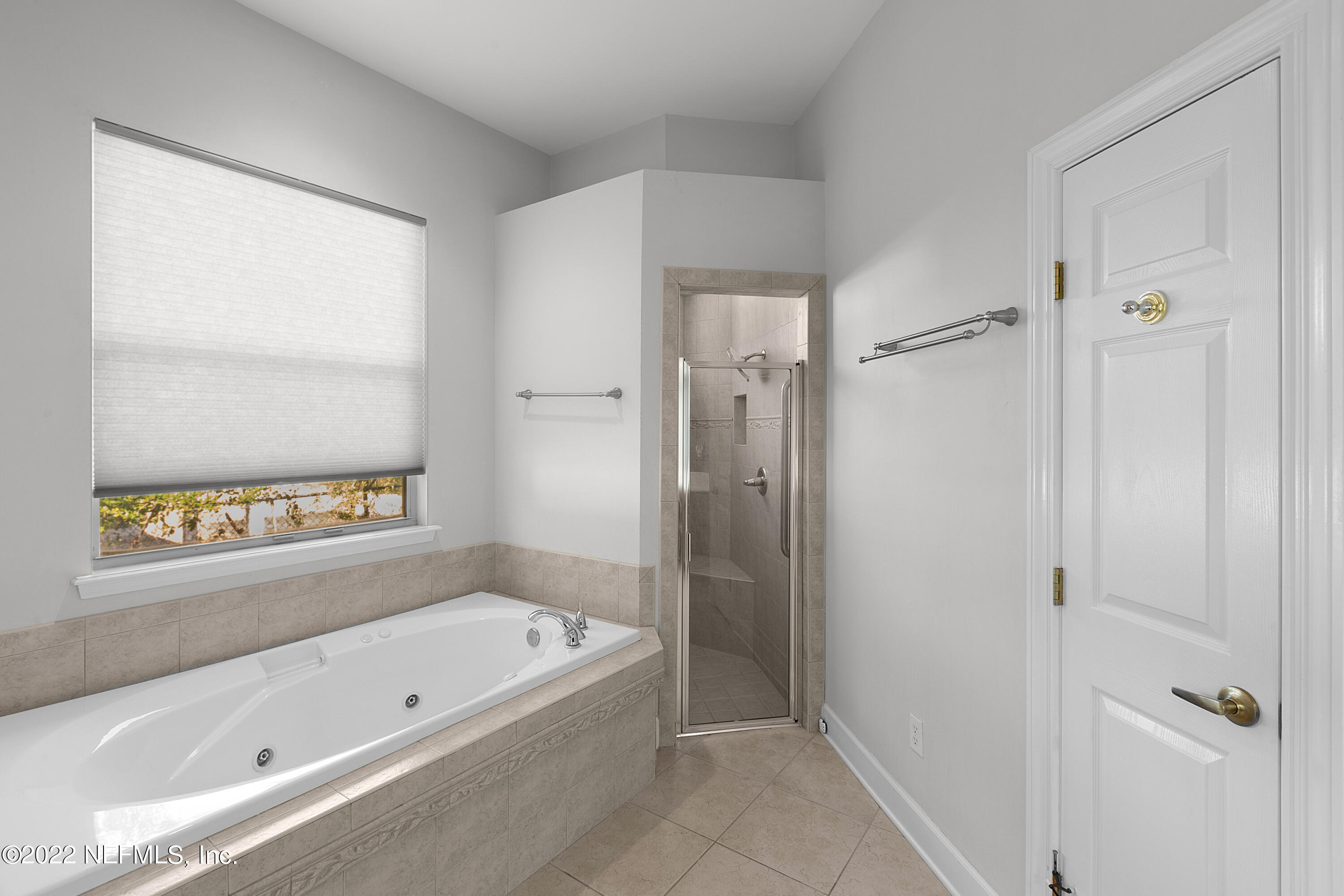 13263 Fort Caroline Road Jacksonville, FL 32225 - Photo 30 of 64 a bathroom with a bathtub and a shower