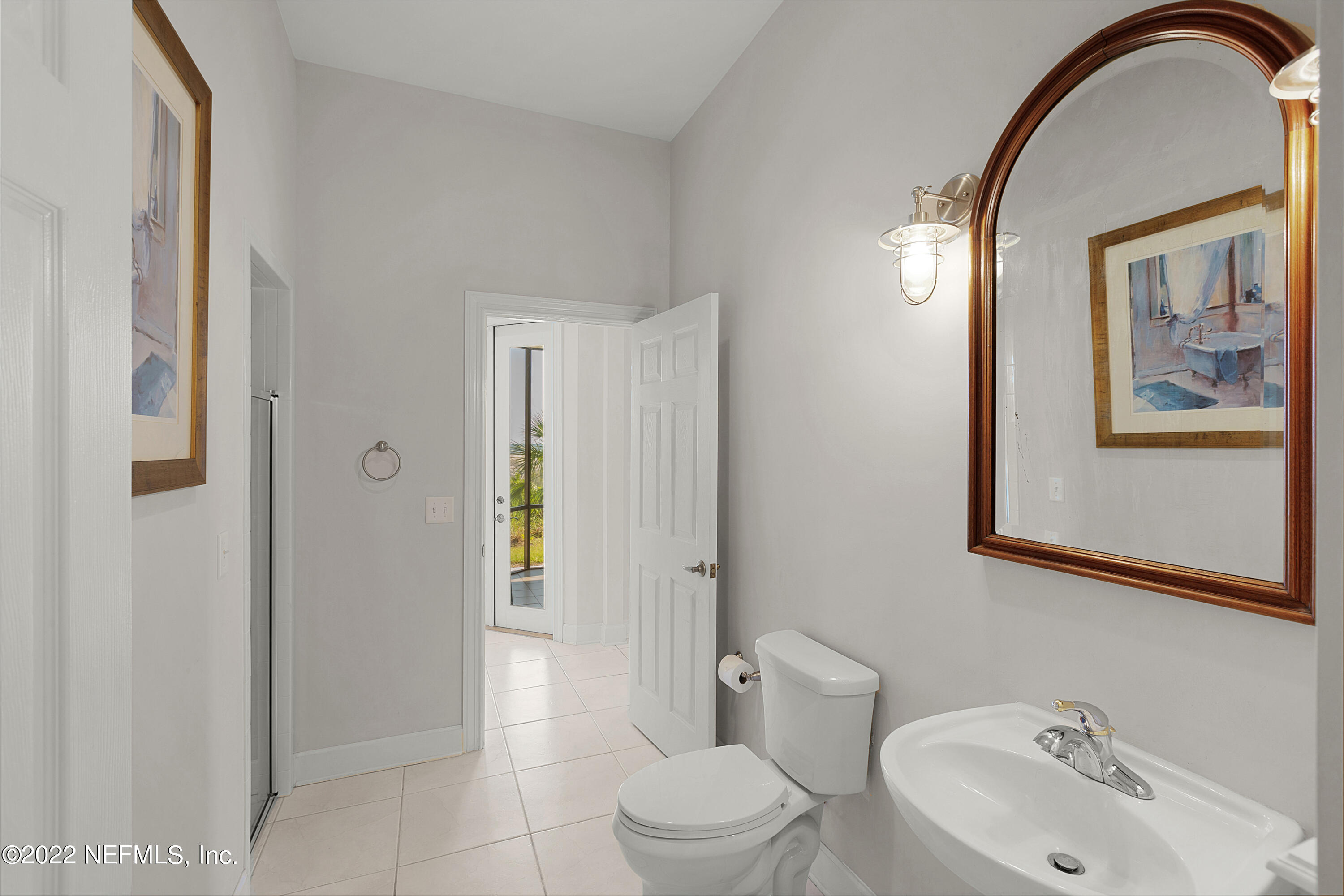 13263 Fort Caroline Road Jacksonville, FL 32225 - Photo 40 of 64 a bathroom with a toilet a sink and mirror