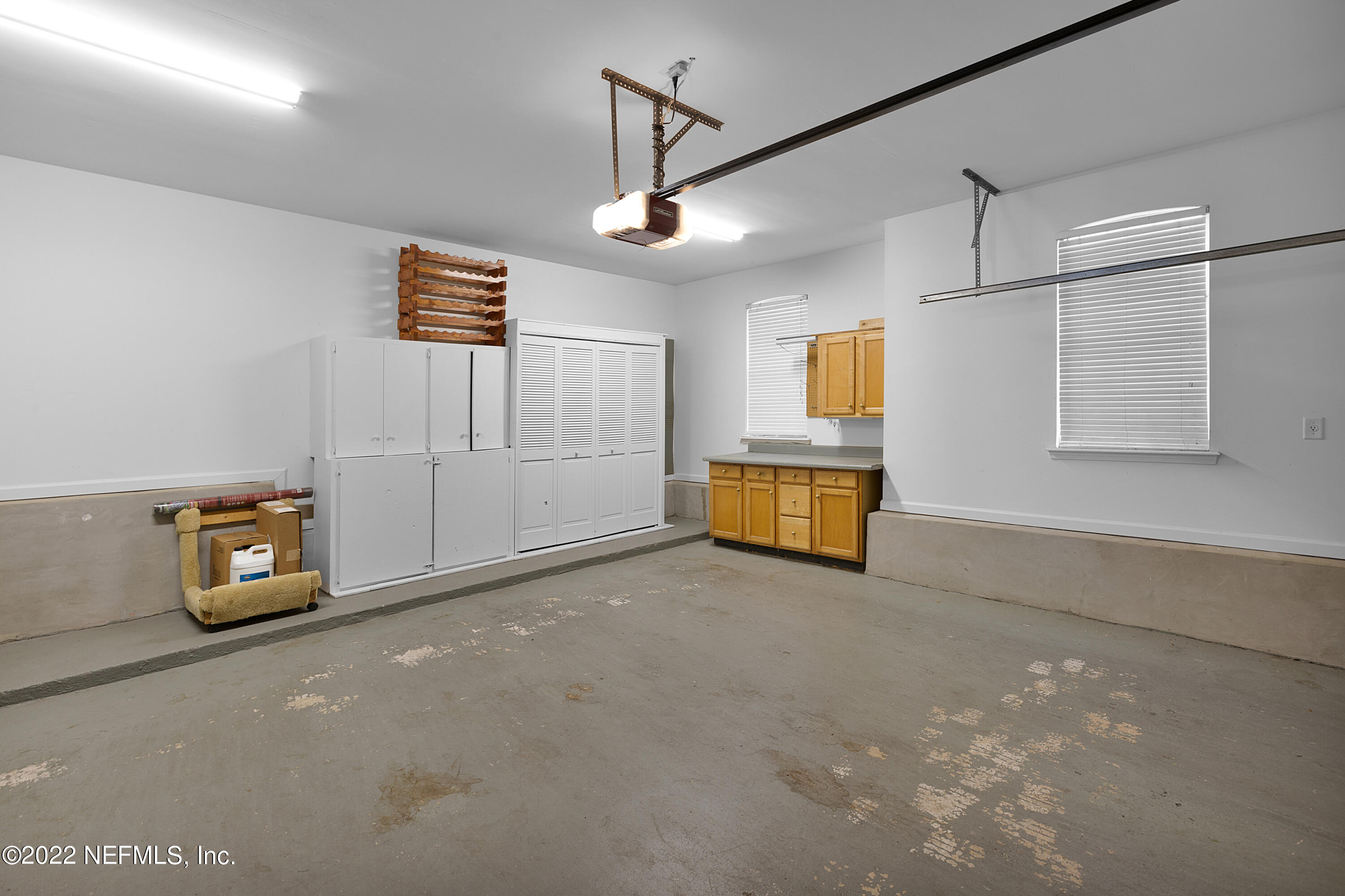 13263 Fort Caroline Road Jacksonville, FL 32225 - Photo 47 of 64 a view of a livingroom with wooden cabinets