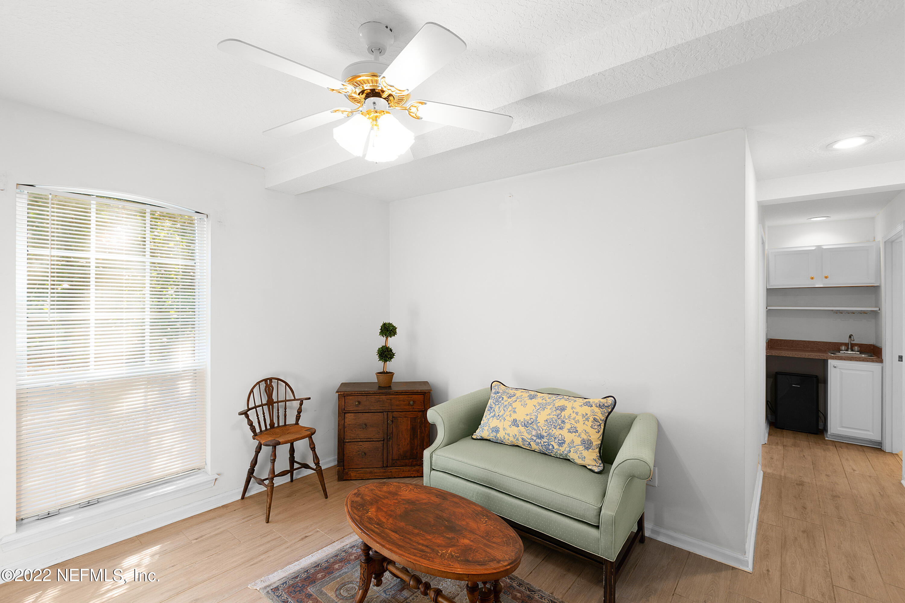 13263 Fort Caroline Road Jacksonville, FL 32225 - Photo 51 of 64 a living room with furniture a chandelier and a window