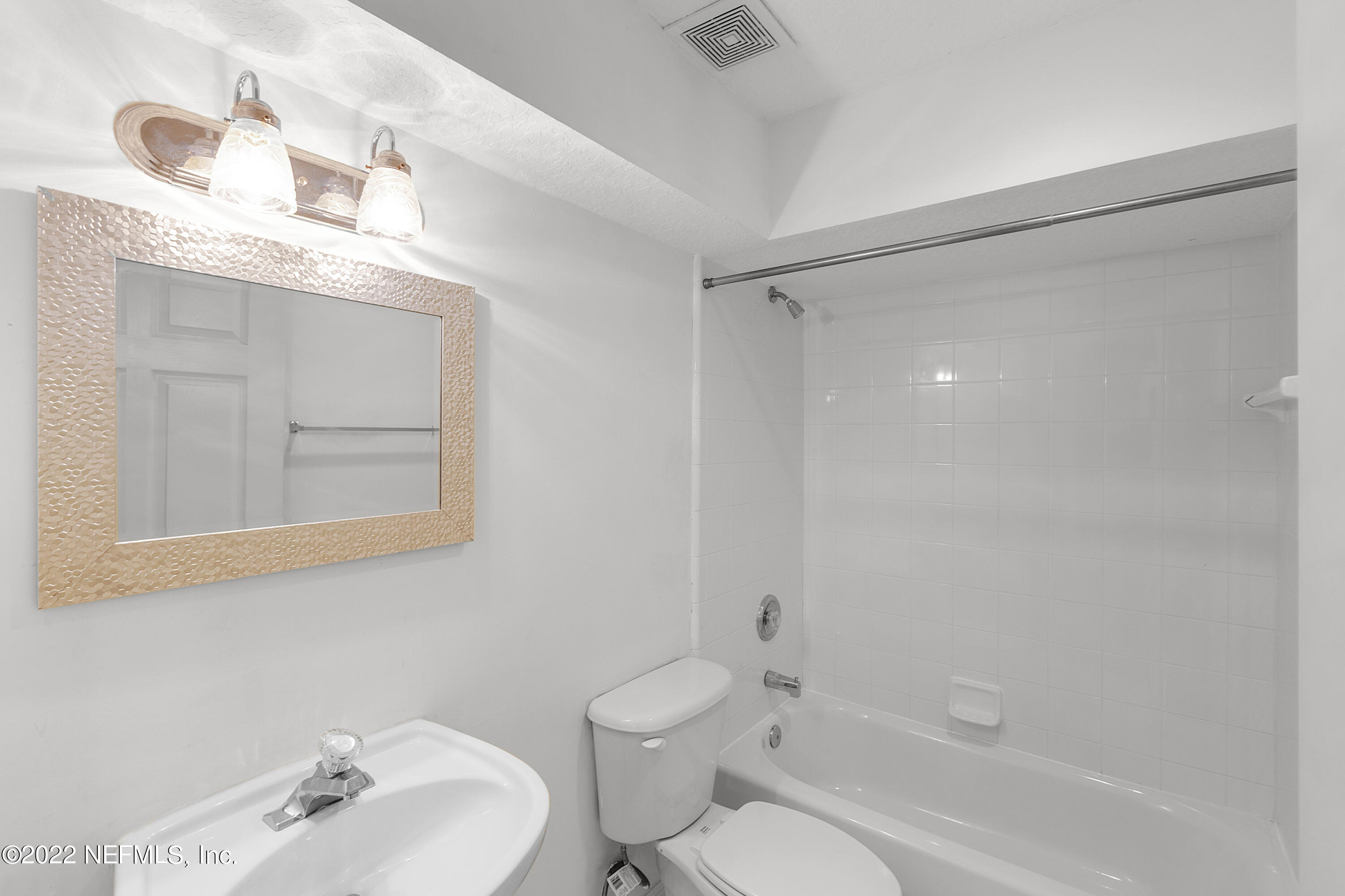 13263 Fort Caroline Road Jacksonville, FL 32225 - Photo 55 of 64 a bathroom with a sink a toilet and shower