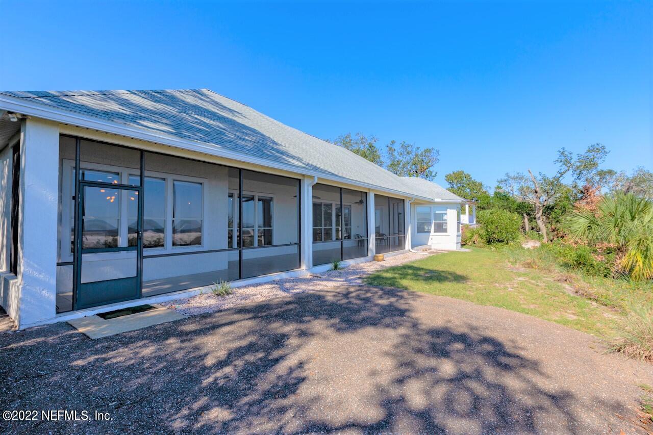13263 Fort Caroline Road Jacksonville, FL 32225 - Photo 57 of 64 a view of a house with a yard and potted plants
