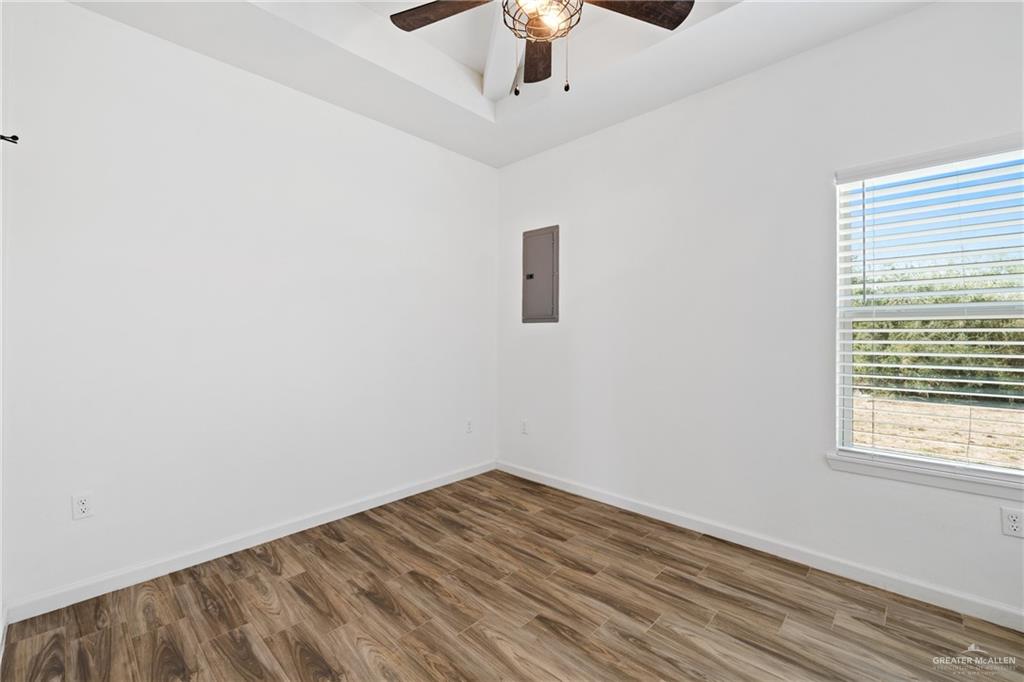 6007 Reymundo Street Edinburg, TX 78542 - Photo 15 of 17 a view of empty room with wooden floor