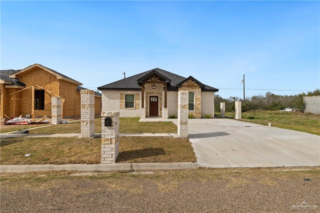 6007 Reymundo Street Edinburg, TX 78542 - Photo 3 of 17 a view of a house next to a yard