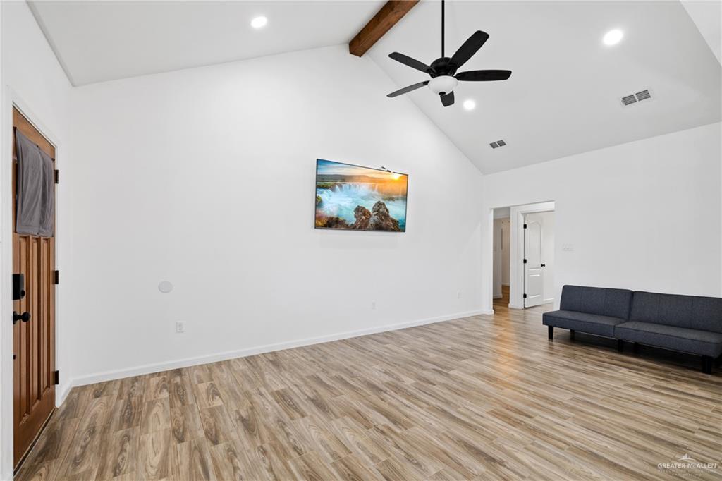 6007 Reymundo Street Edinburg, TX 78542 - Photo 7 of 17 wooden floor in an empty room with a window
