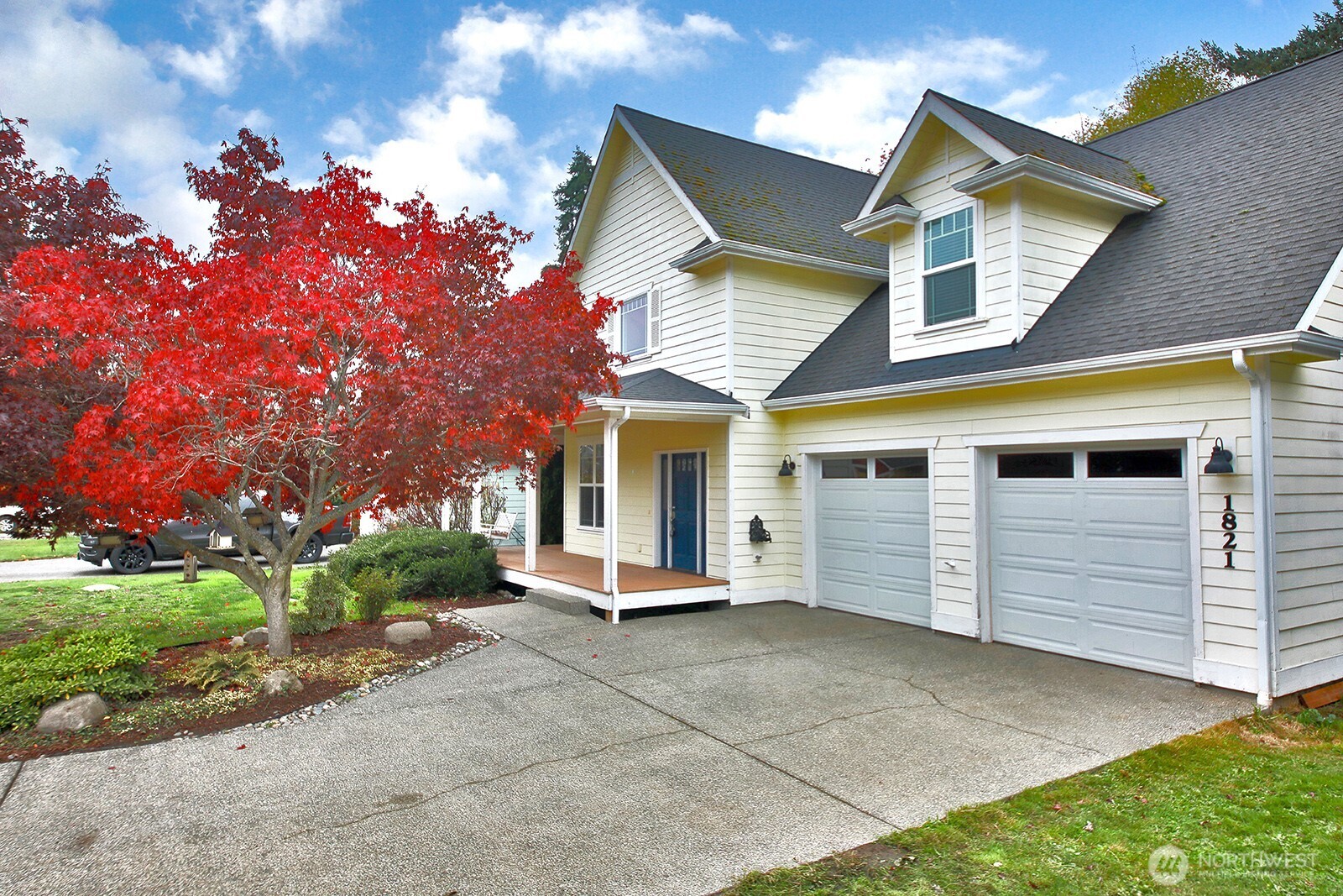 a front view of a house with a garden