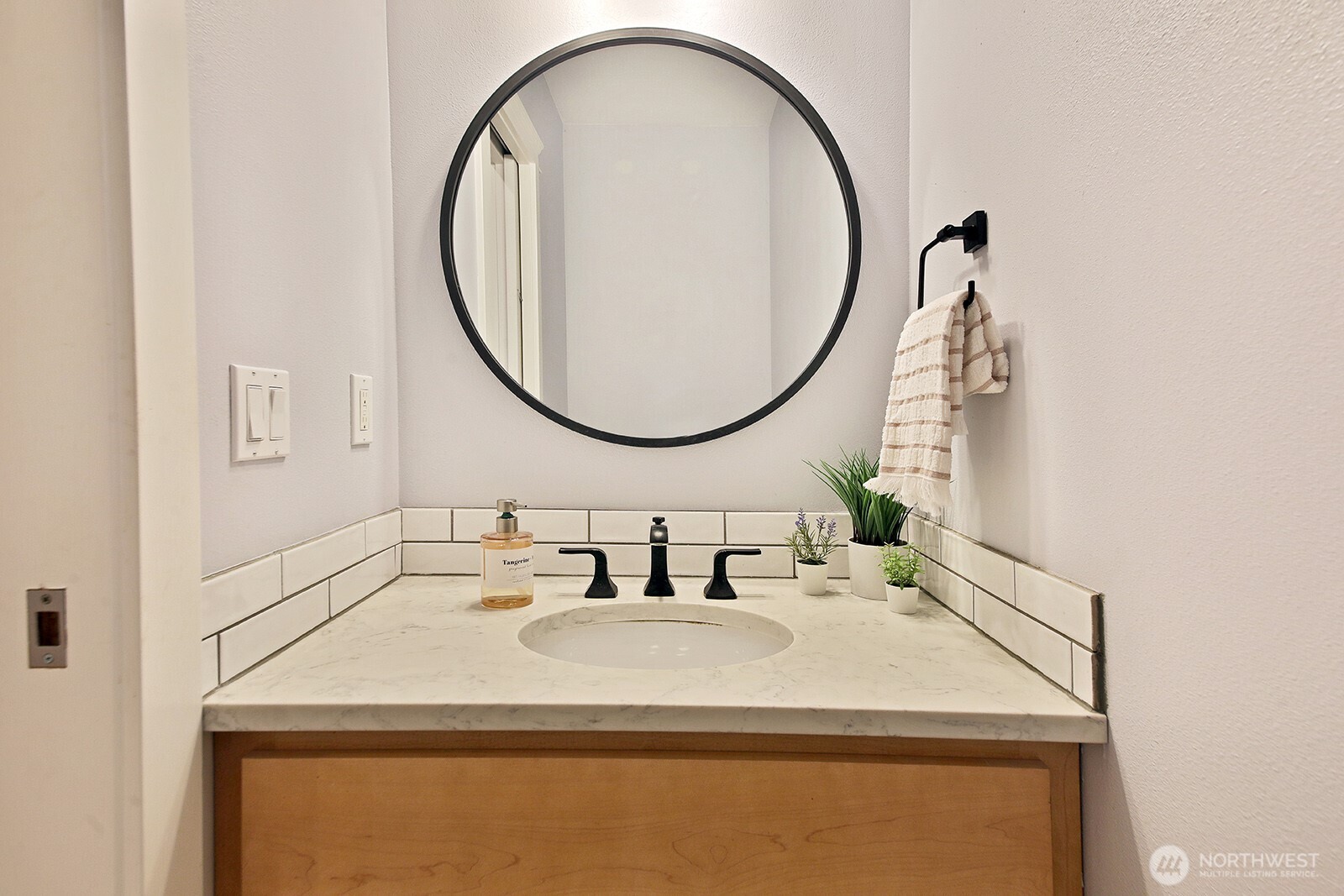 1821 Watkins Road Freeland, WA 98249 - Photo 17 of 28 a bathroom with a sink and a mirror