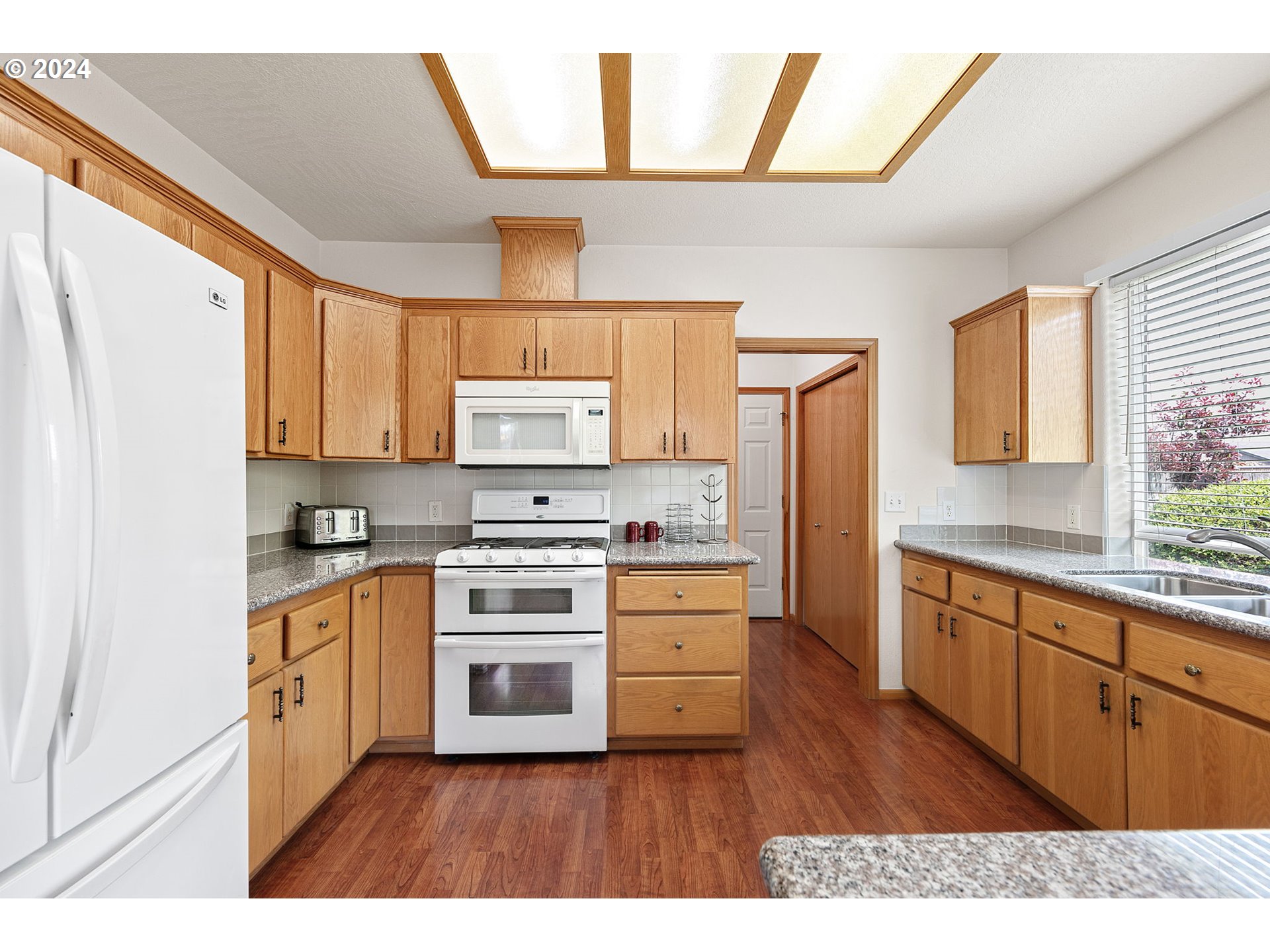815 R Street Springfield, OR 97477 - Photo 17 of 37 a kitchen with stainless steel appliances a stove a sink and a refrigerator