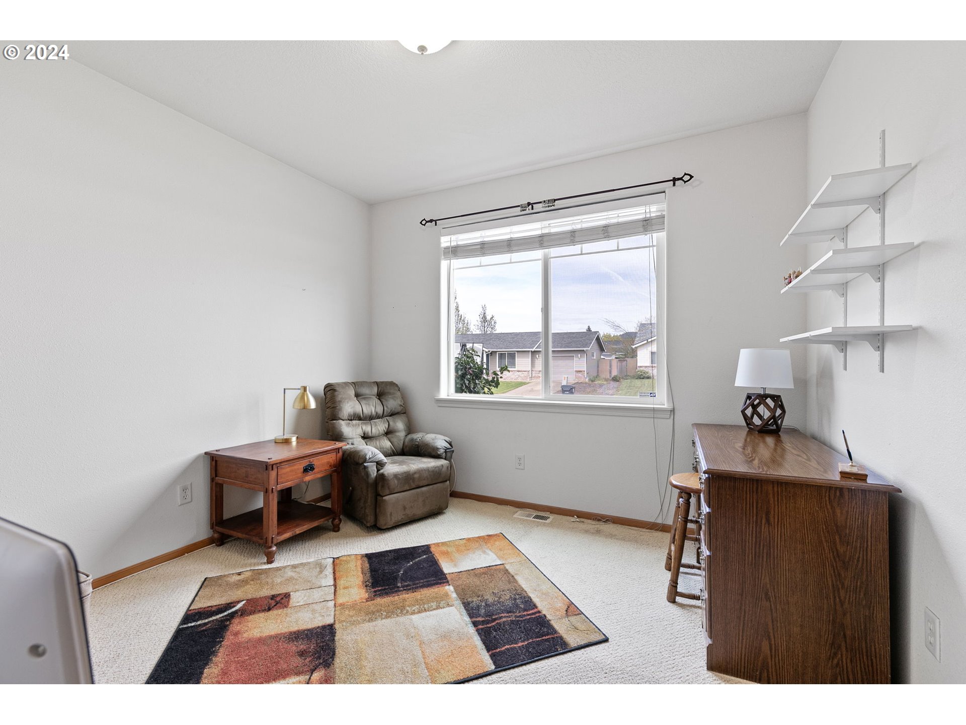 815 R Street Springfield, OR 97477 - Photo 27 of 37 a reading room with furniture and a window