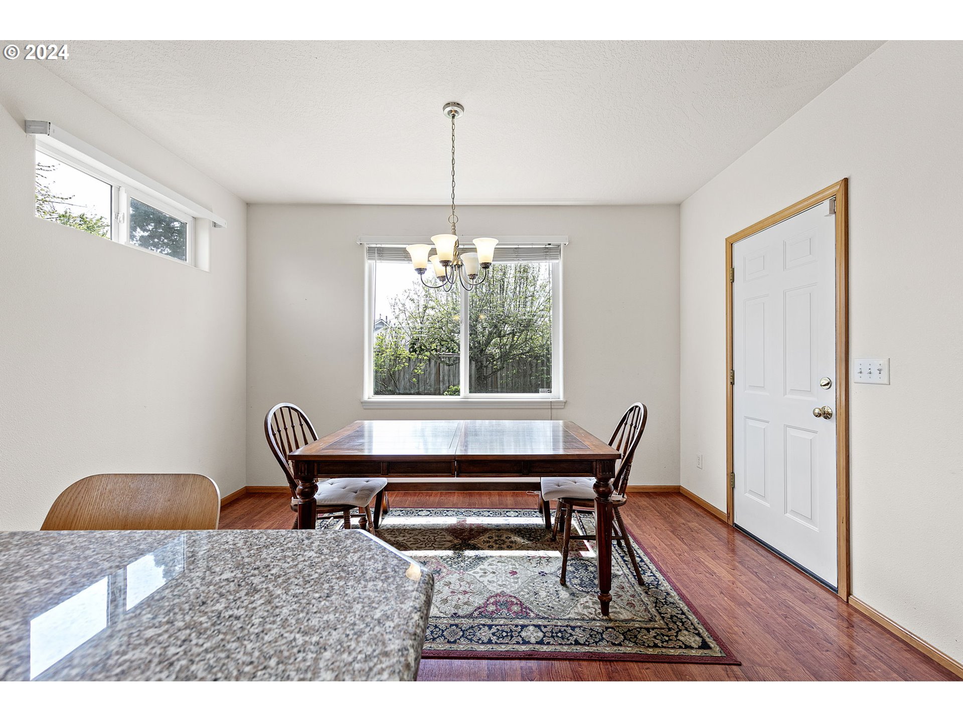 815 R Street Springfield, OR 97477 - Photo 31 of 37 a dining room with a wooden table and chairs