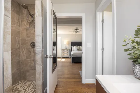a en suite bathroom with a sink and a mirror