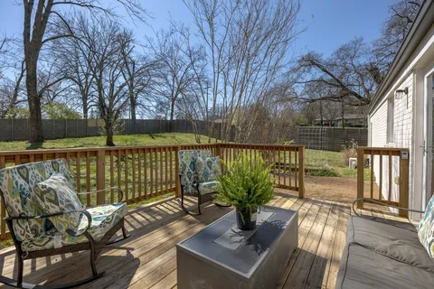 a view of a balcony with lake view and wooden floor