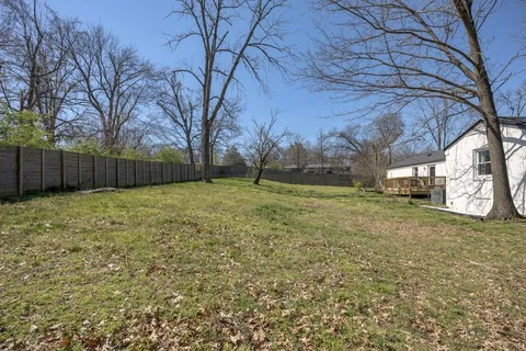 a backyard of a house with lots of green space