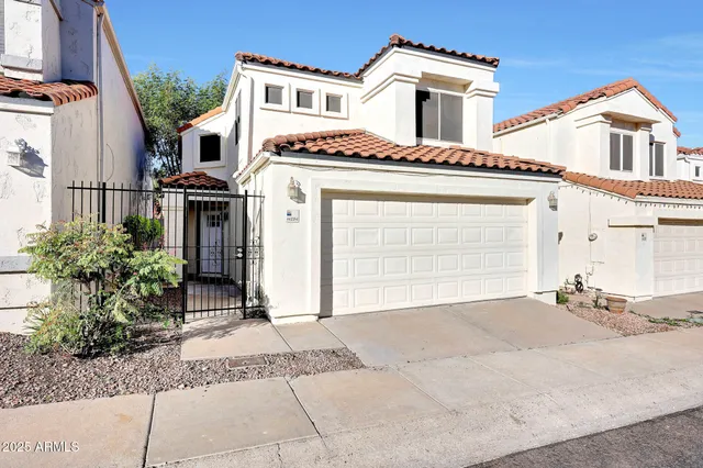 a front view of a house with a garage