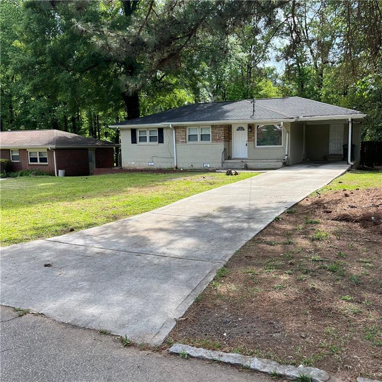 2089 Barbara Lane Decatur, GA 30032 - Photo 1 of 1 a front view of a house with a garden