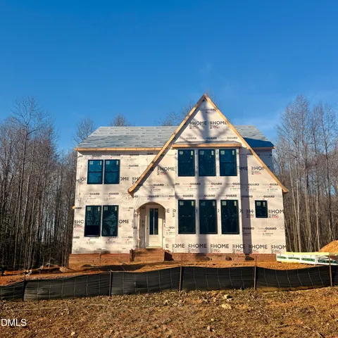 a front view of house with street