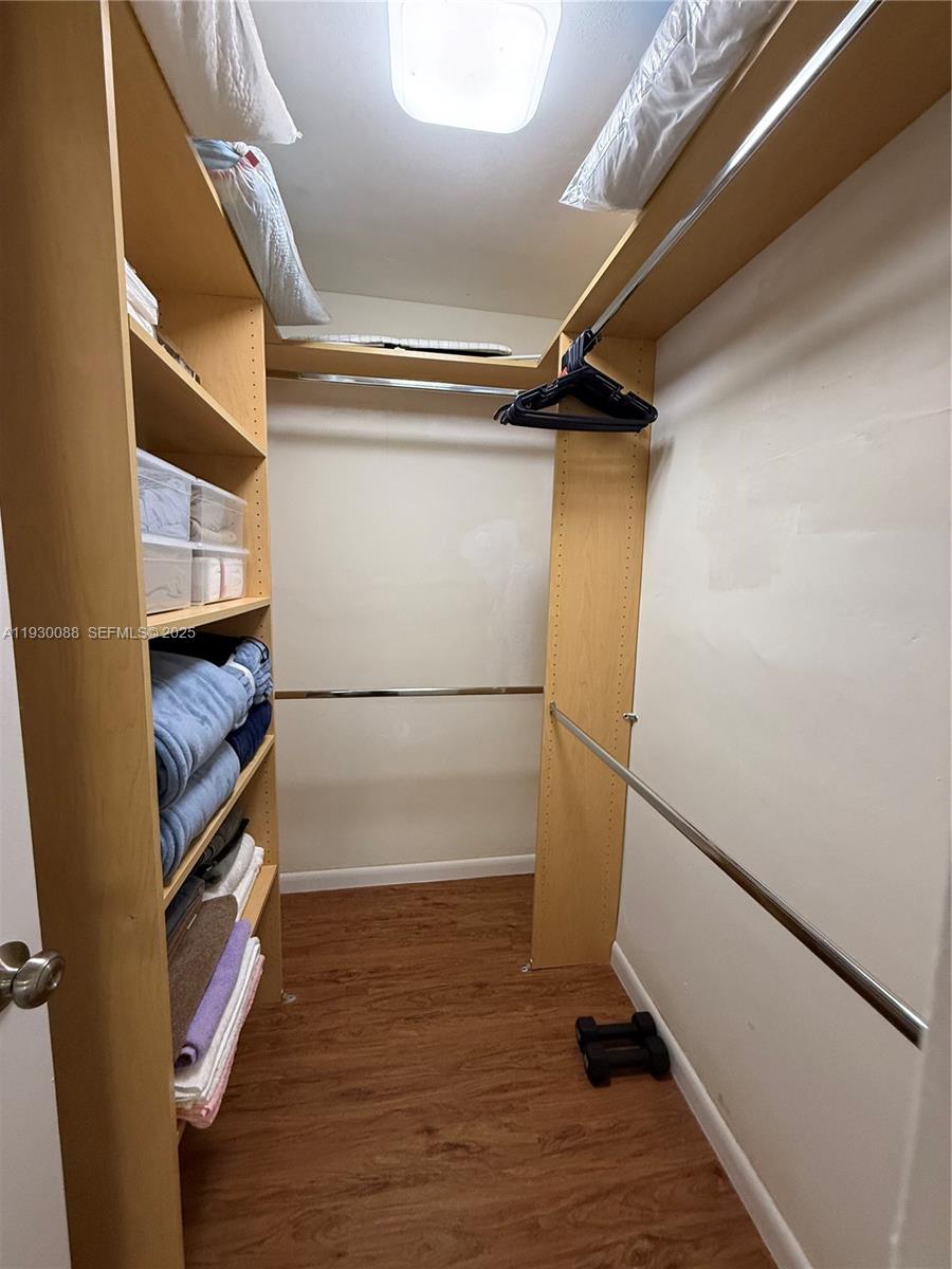 900 Tallwood Avenue, Unit 306 Hollywood, FL 33021 - Photo 21 of 30 a view of an empty walk in closet