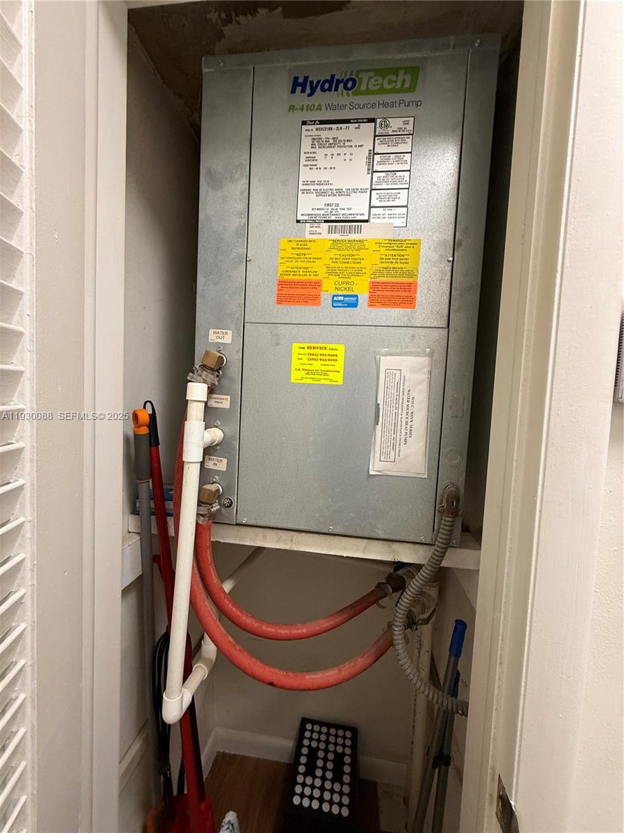 900 Tallwood Avenue, Unit 306 Hollywood, FL 33021 - Photo 23 of 30 a bathroom with a tub and sink