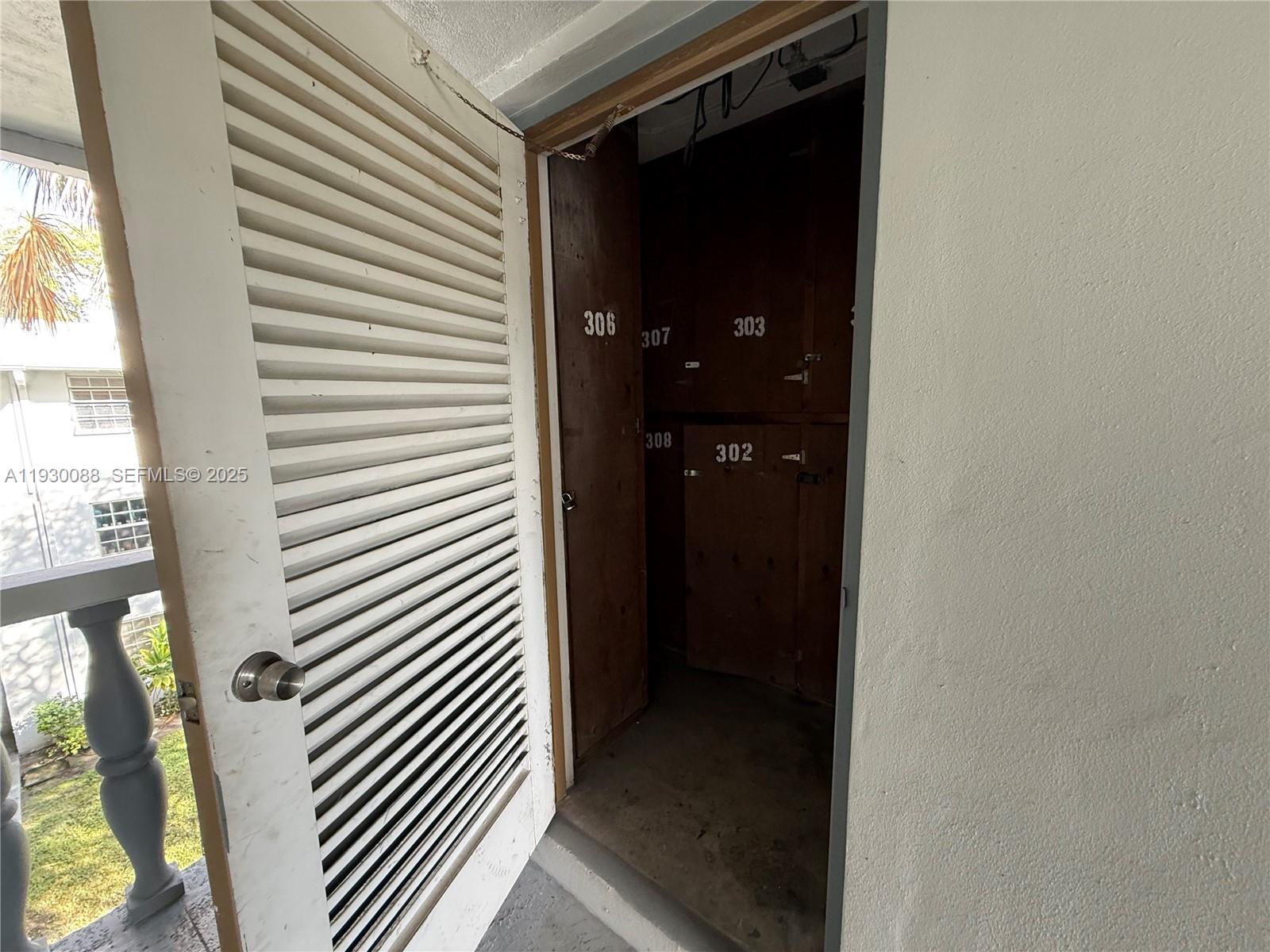 900 Tallwood Avenue, Unit 306 Hollywood, FL 33021 - Photo 27 of 30 a view of a hallway