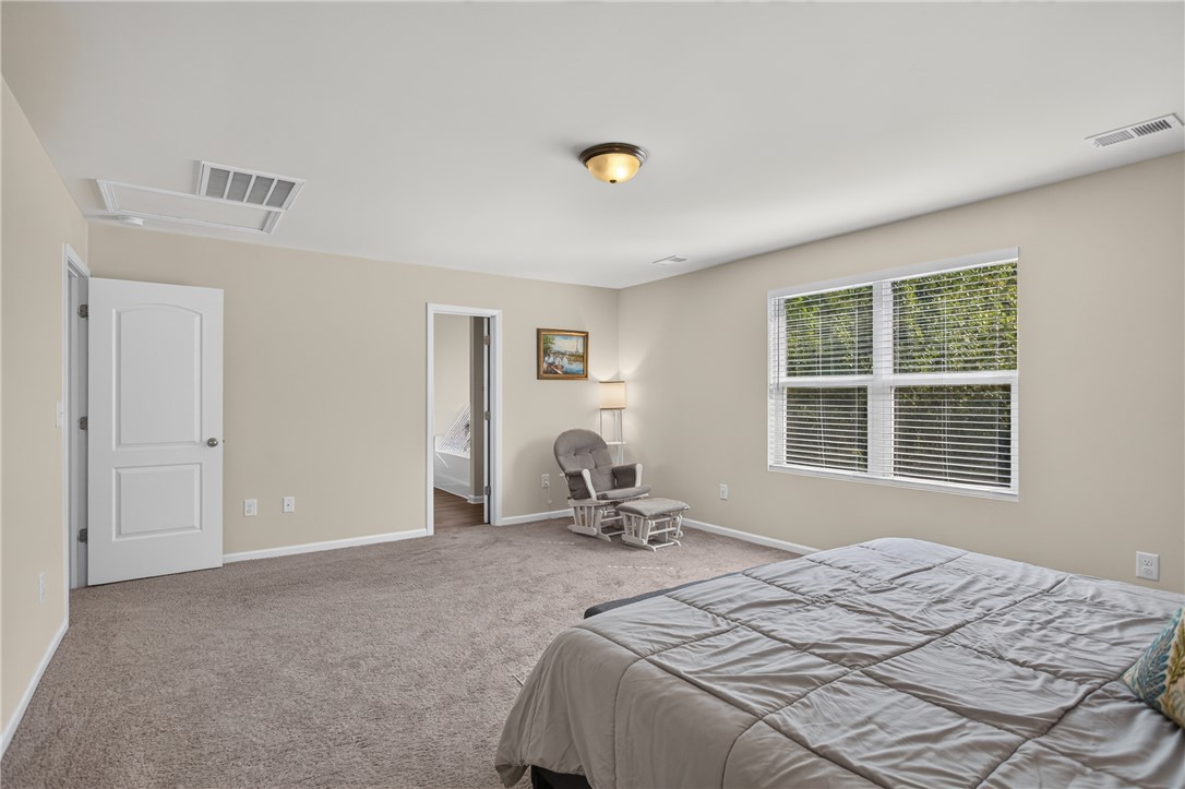 1081 Edenbrooke Circle Anderson, SC 29621 - Photo 25 of 46 A restful bedroom offers soft carpeting and a window providing a pleasant outdoor view.