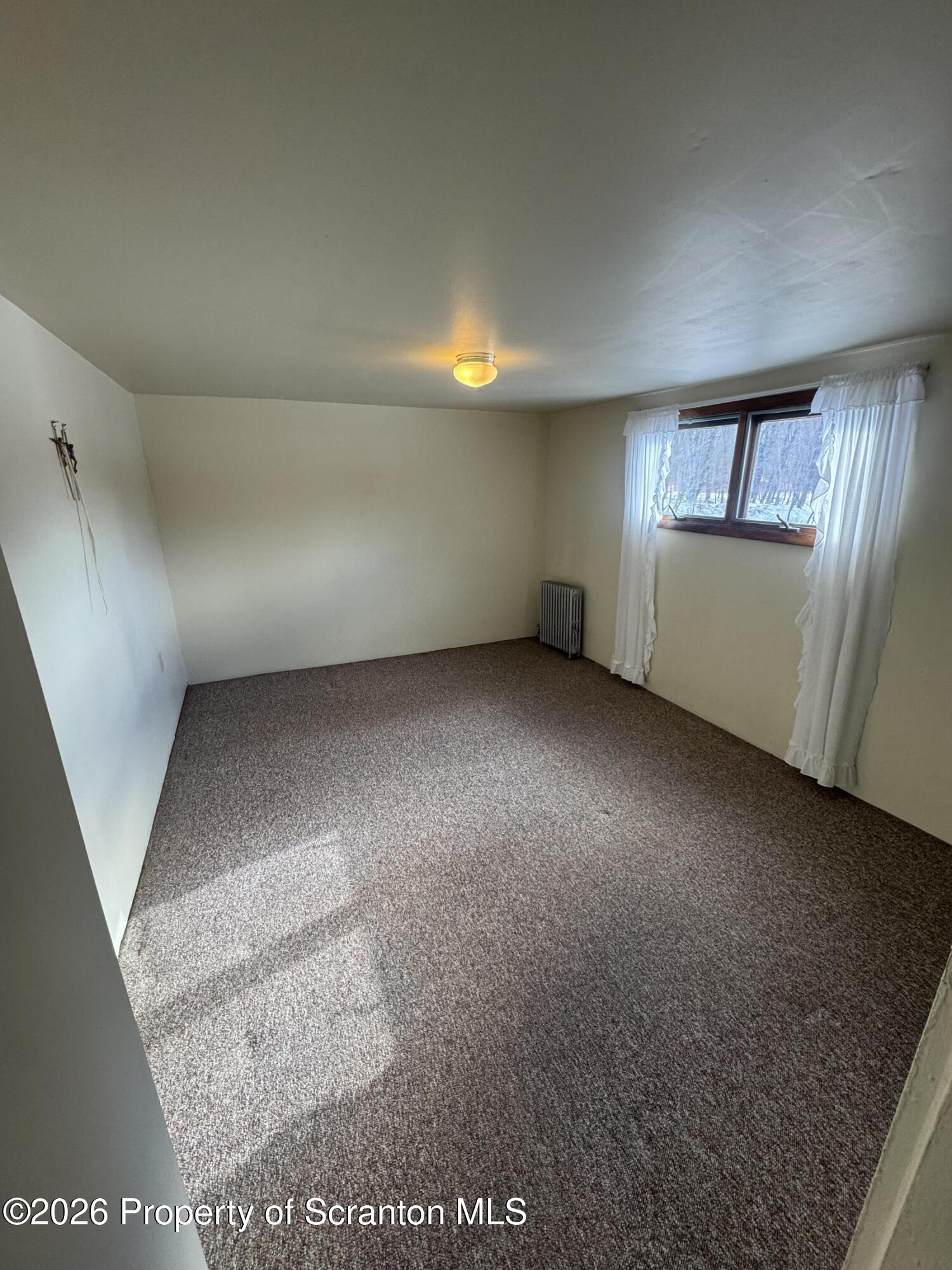 203 Laurel Street Archbald, PA 18403 - Photo 12 of 28 an empty room with windows
