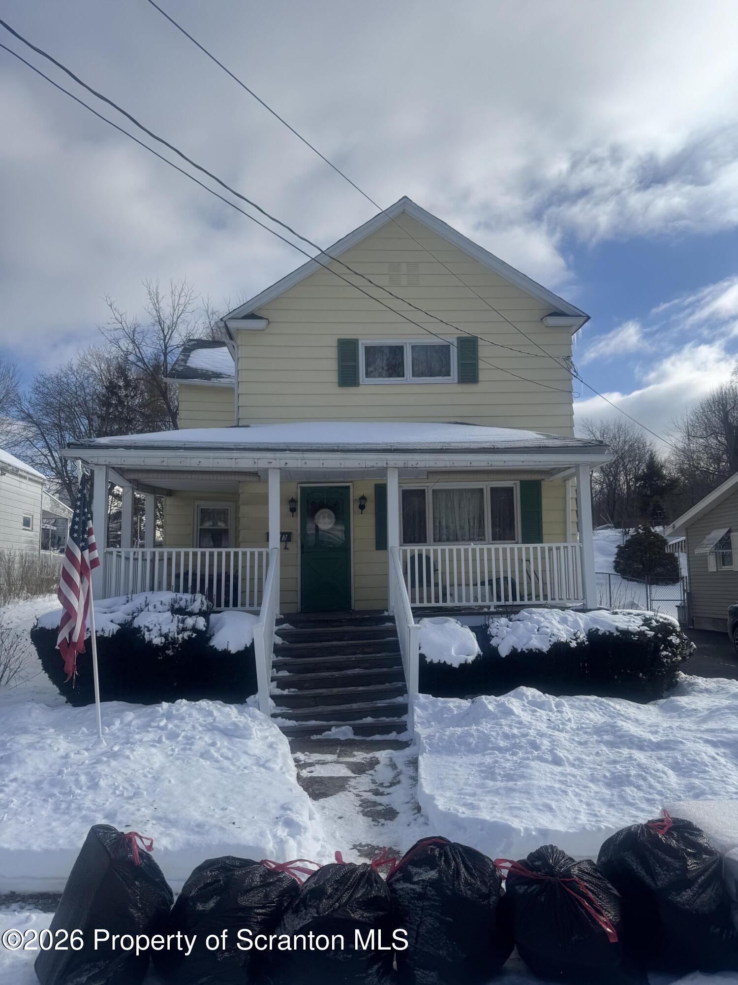 203 Laurel Street Archbald, PA 18403 - Photo 2 of 28 a view of a house with a yard and a patio