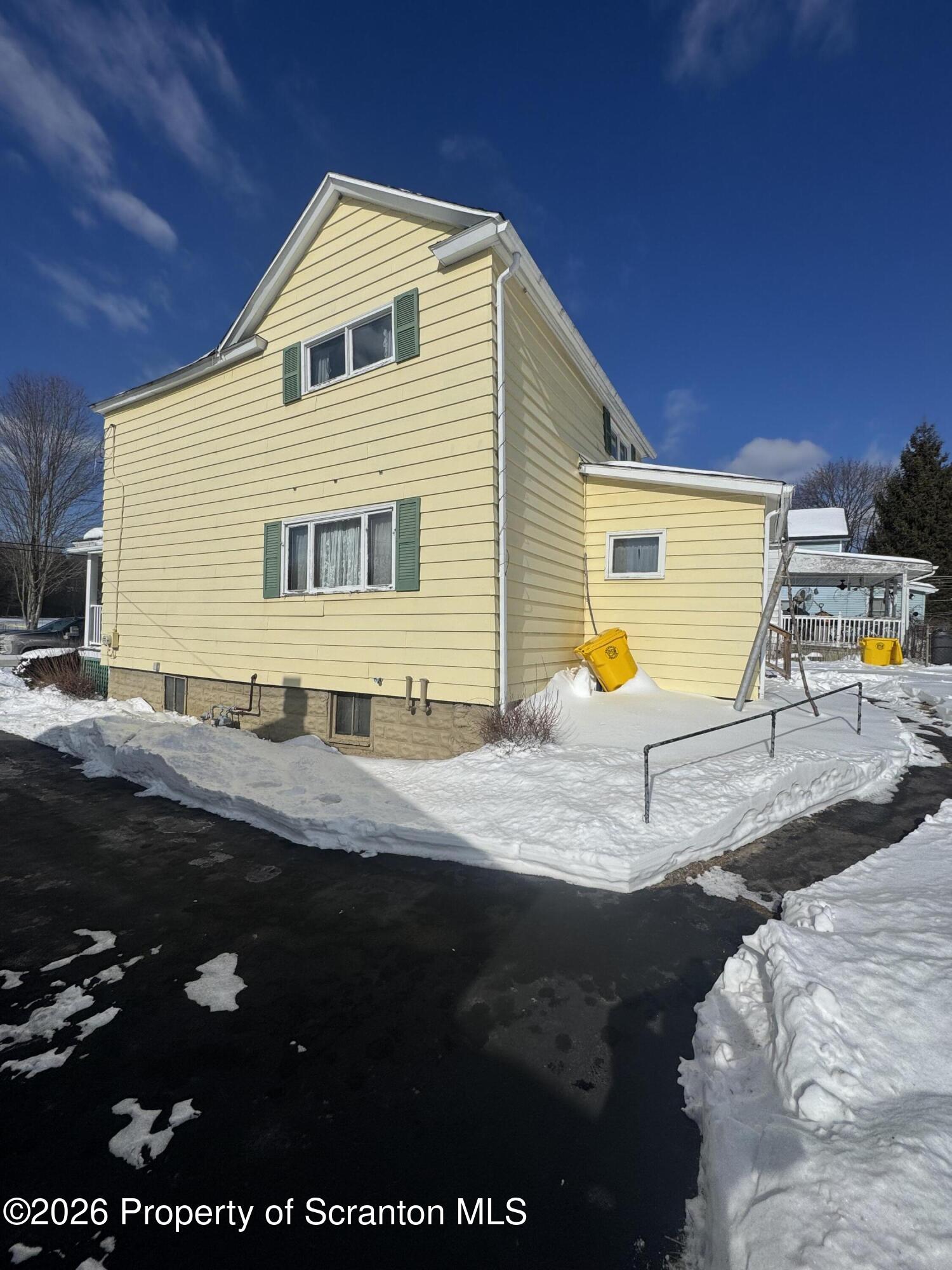 203 Laurel Street Archbald, PA 18403 - Photo 28 of 28 a front view of a house with garden
