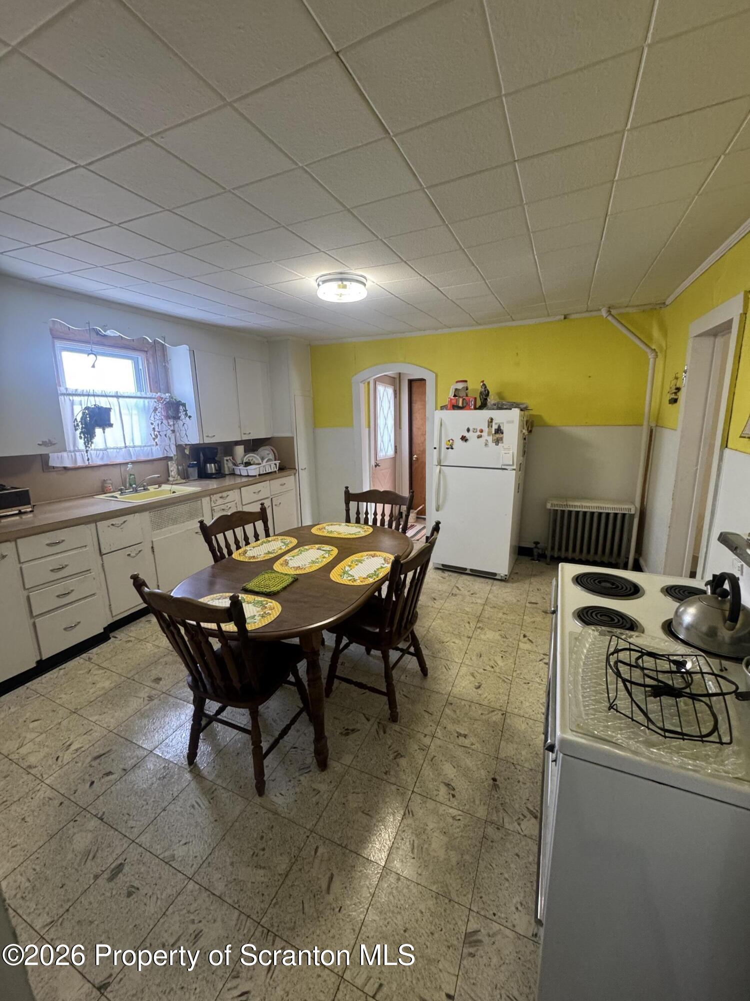 203 Laurel Street Archbald, PA 18403 - Photo 4 of 28 a living room with stainless steel appliances kitchen island granite countertop furniture and a kitchen view