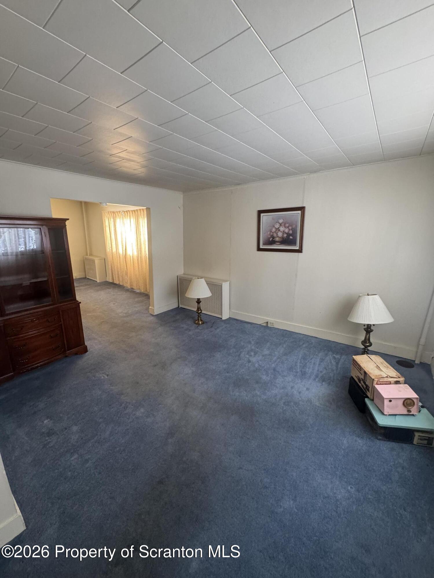 203 Laurel Street Archbald, PA 18403 - Photo 7 of 28 a living room with furniture and a window