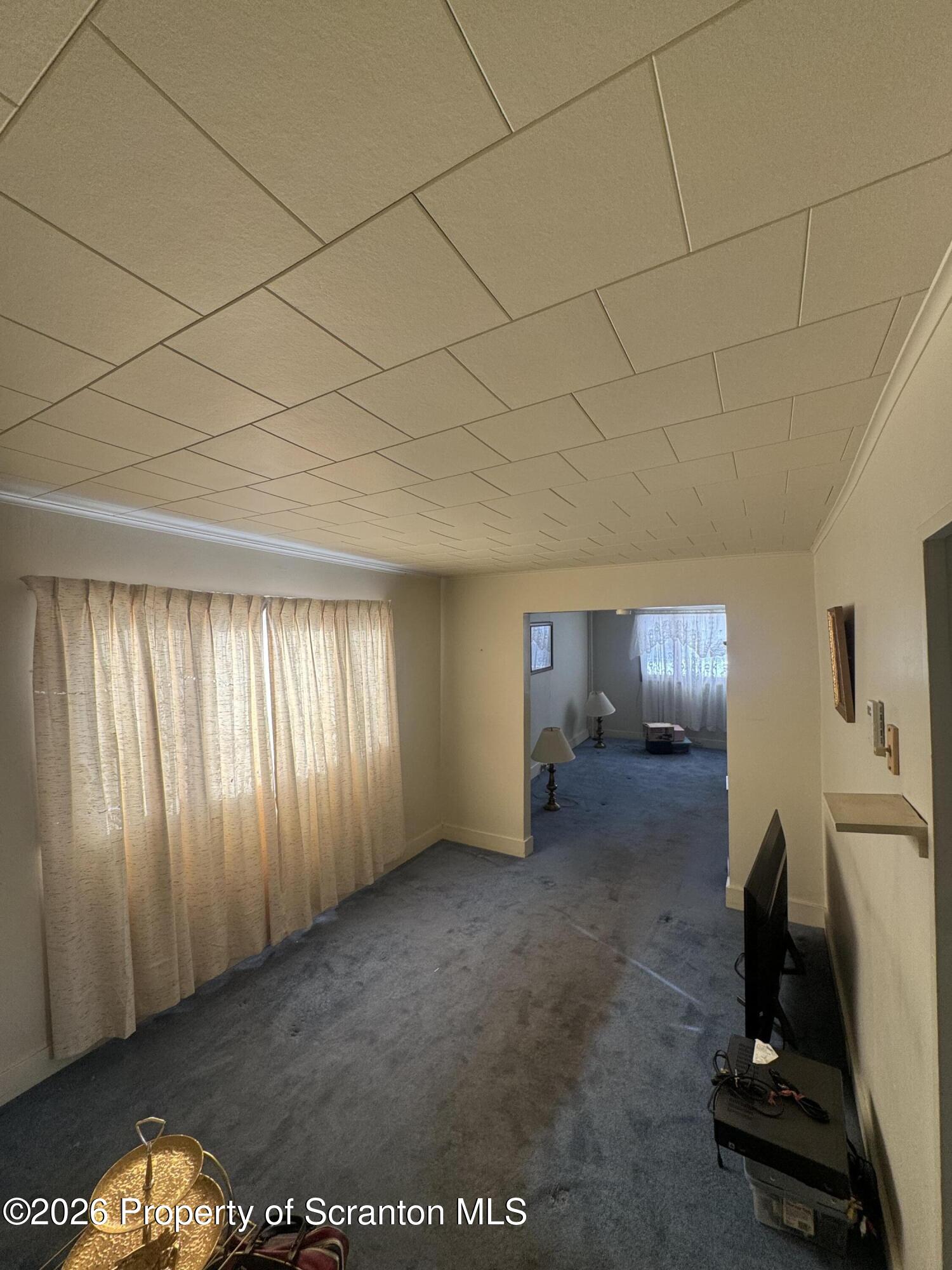 203 Laurel Street Archbald, PA 18403 - Photo 10 of 28 a view of an empty room and a window